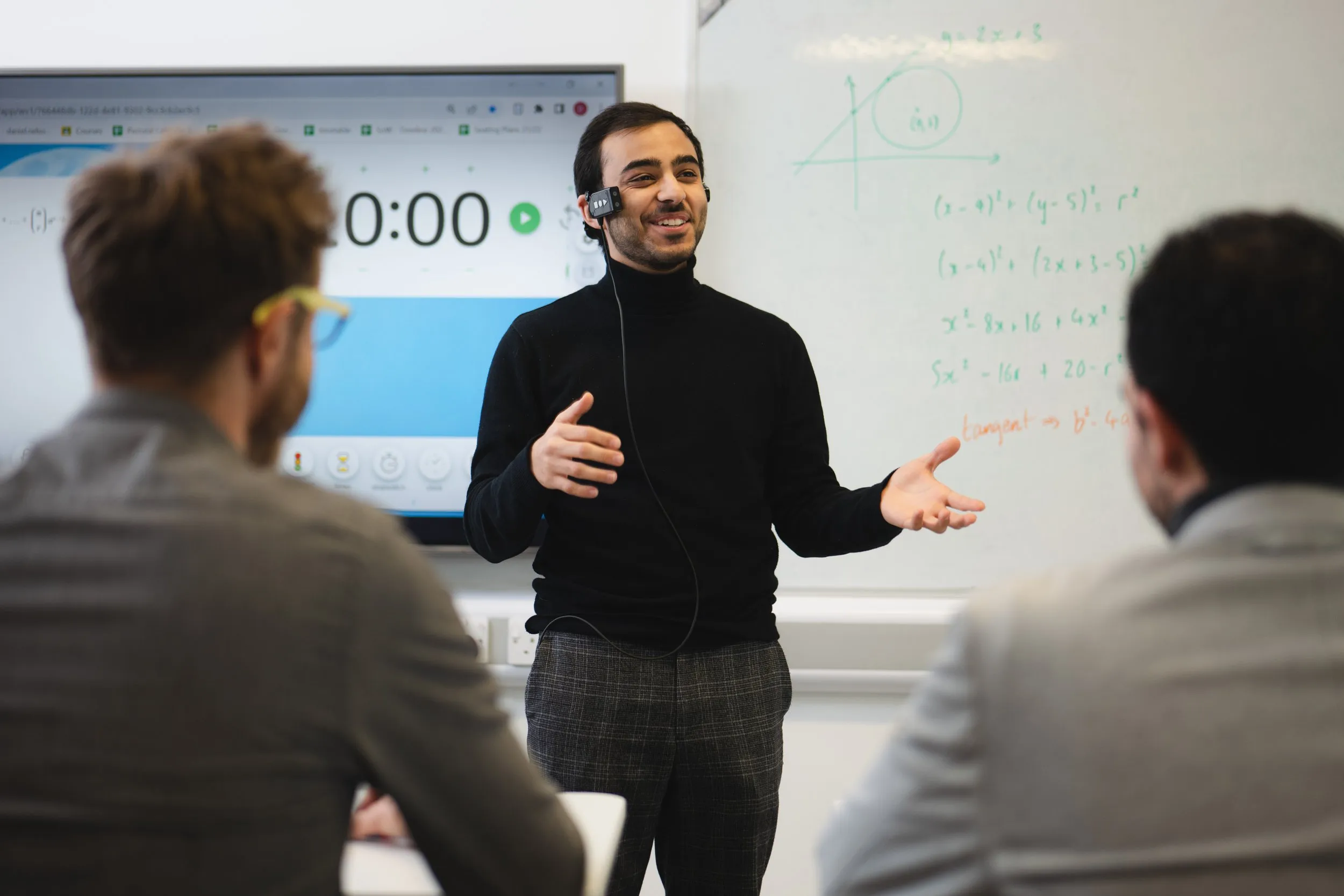 Presenter addressing a classroom in an edtech setting, corporate lifestyle photography, London