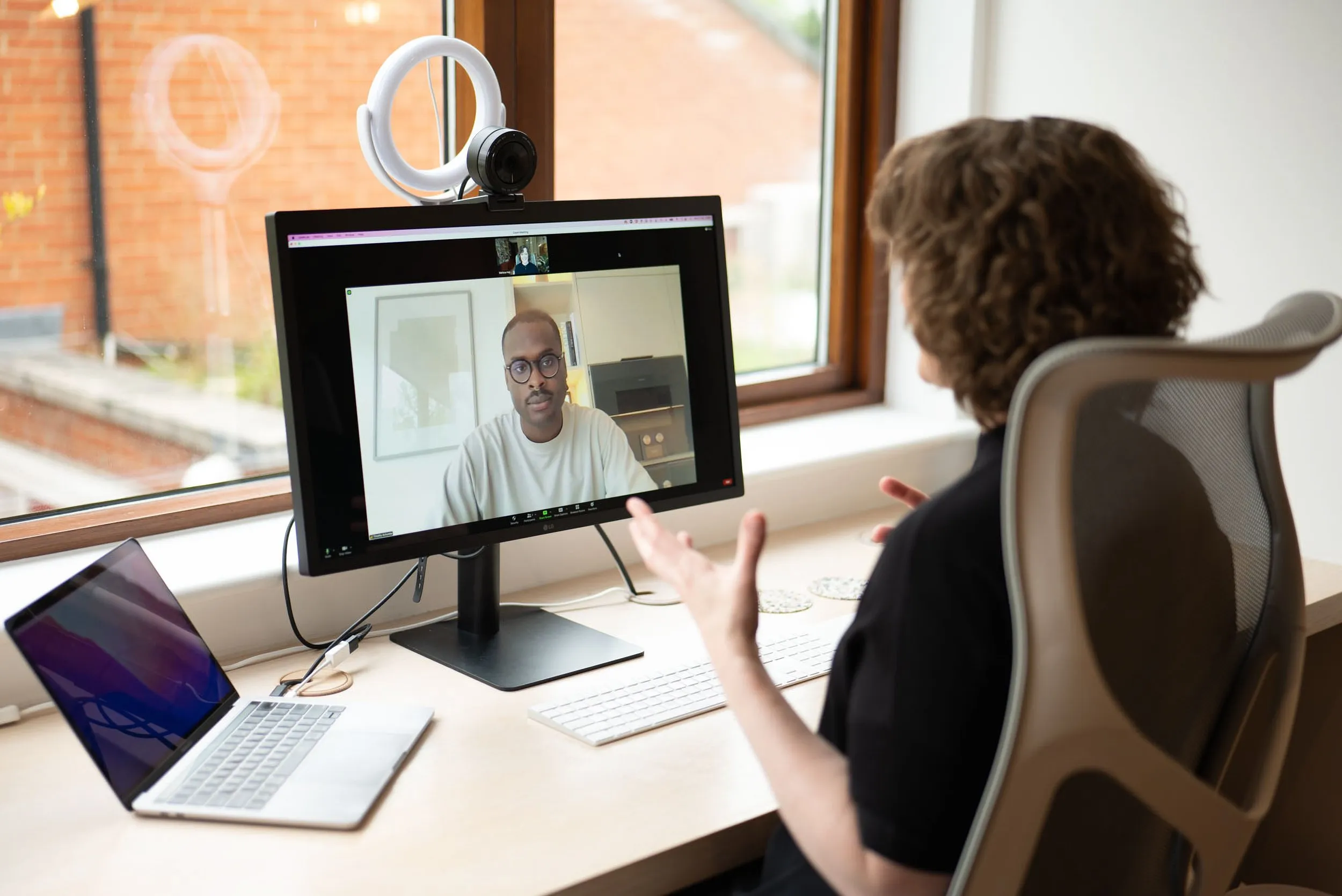 Professional on a video call working from home office, remote working lifestyle photography