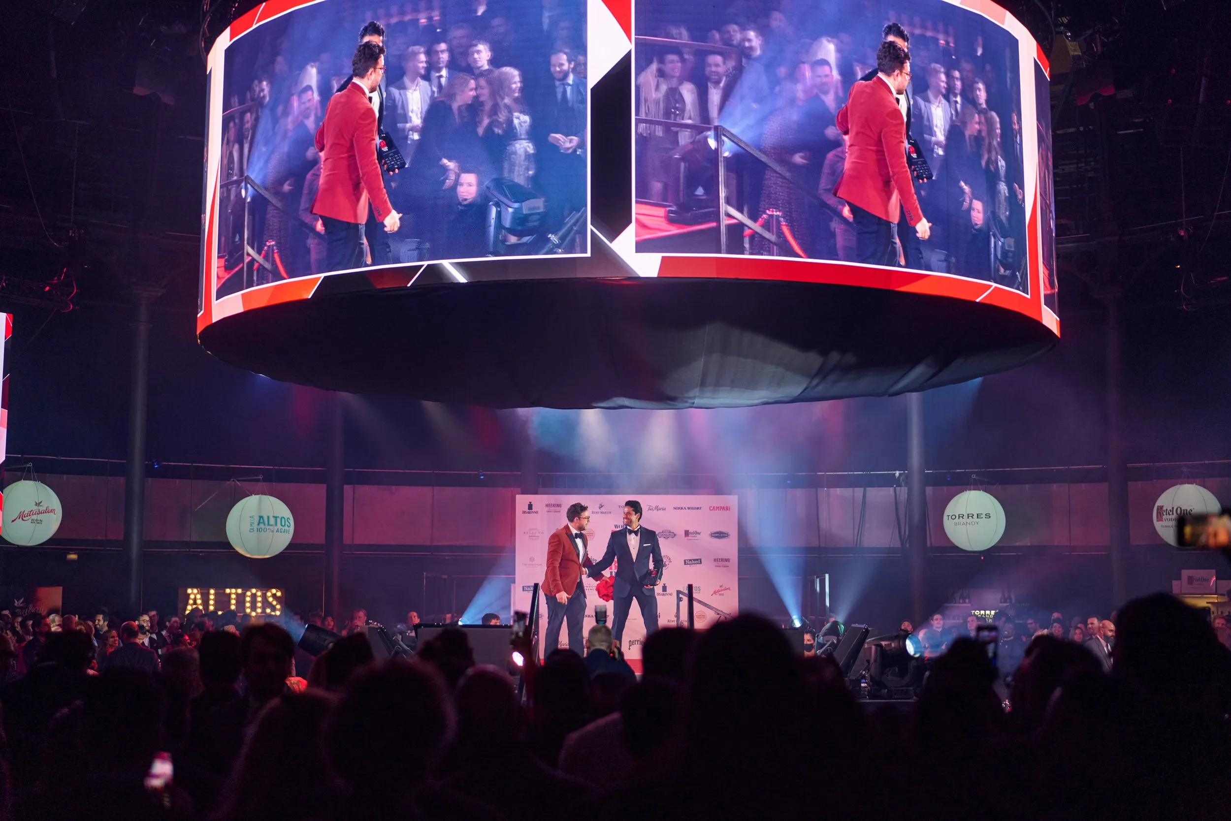 Aerial view of corporate cocktail event with large crowd at bar, London event photography