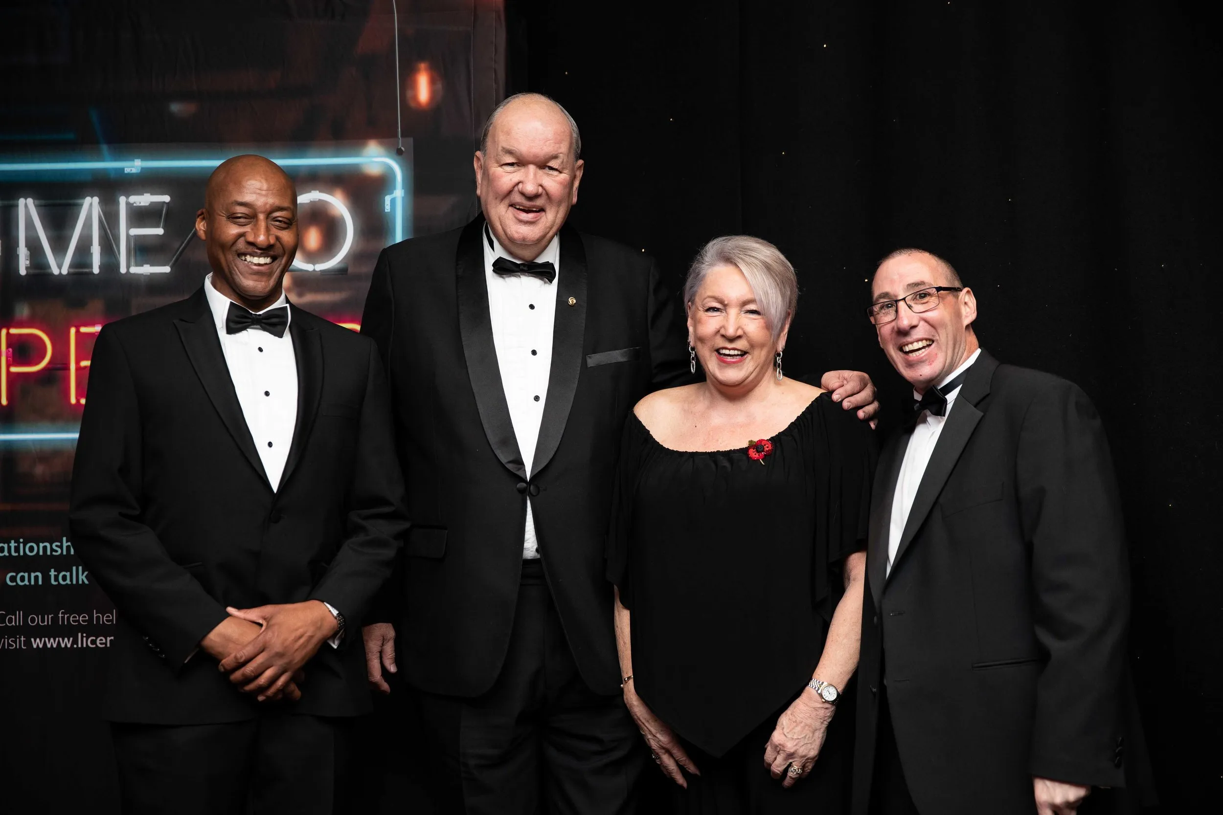 Group photo at a black tie charity gala dinner, London corporate event photography
