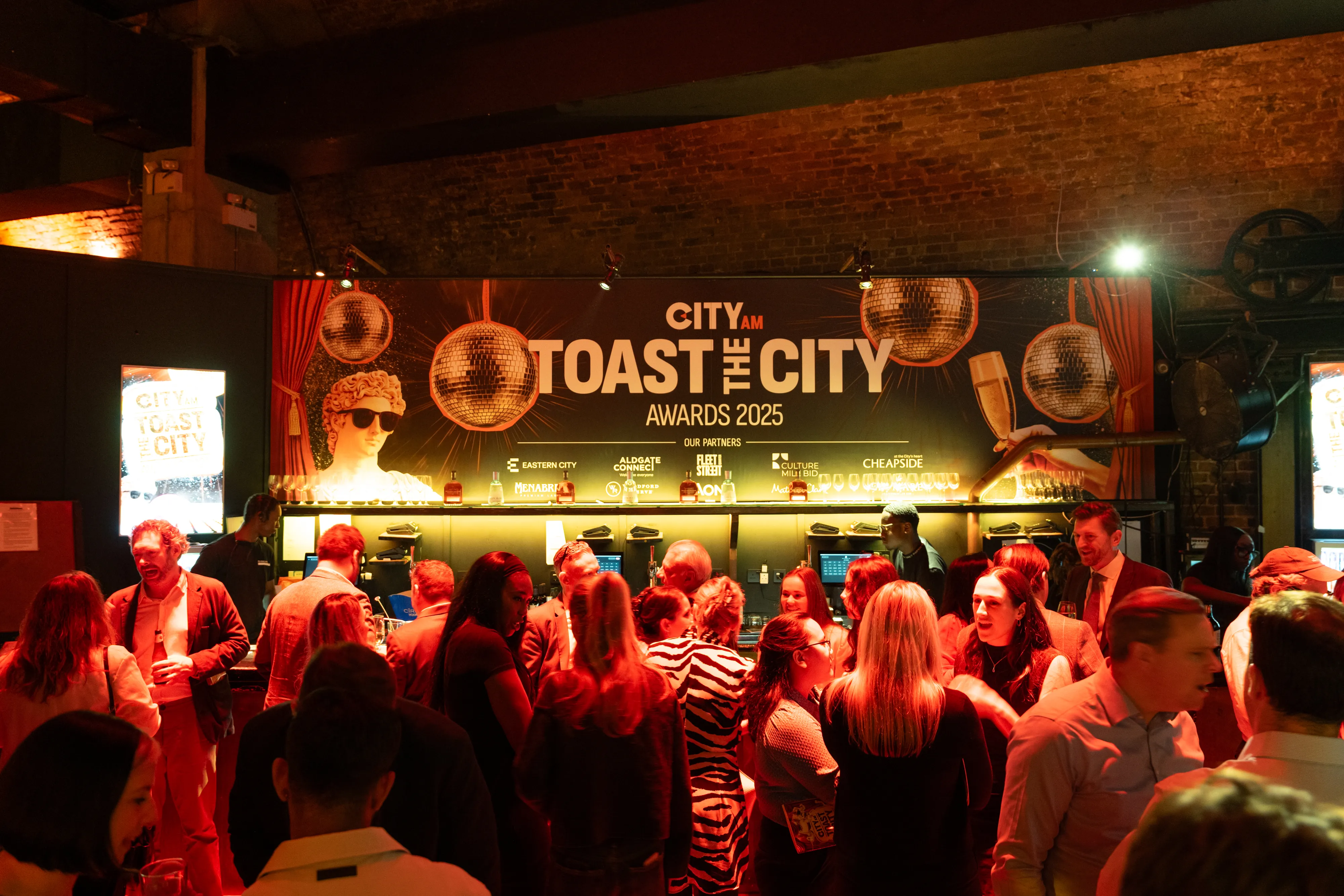CityAM awards networking drinks at branded bar backdrop, London event photography
