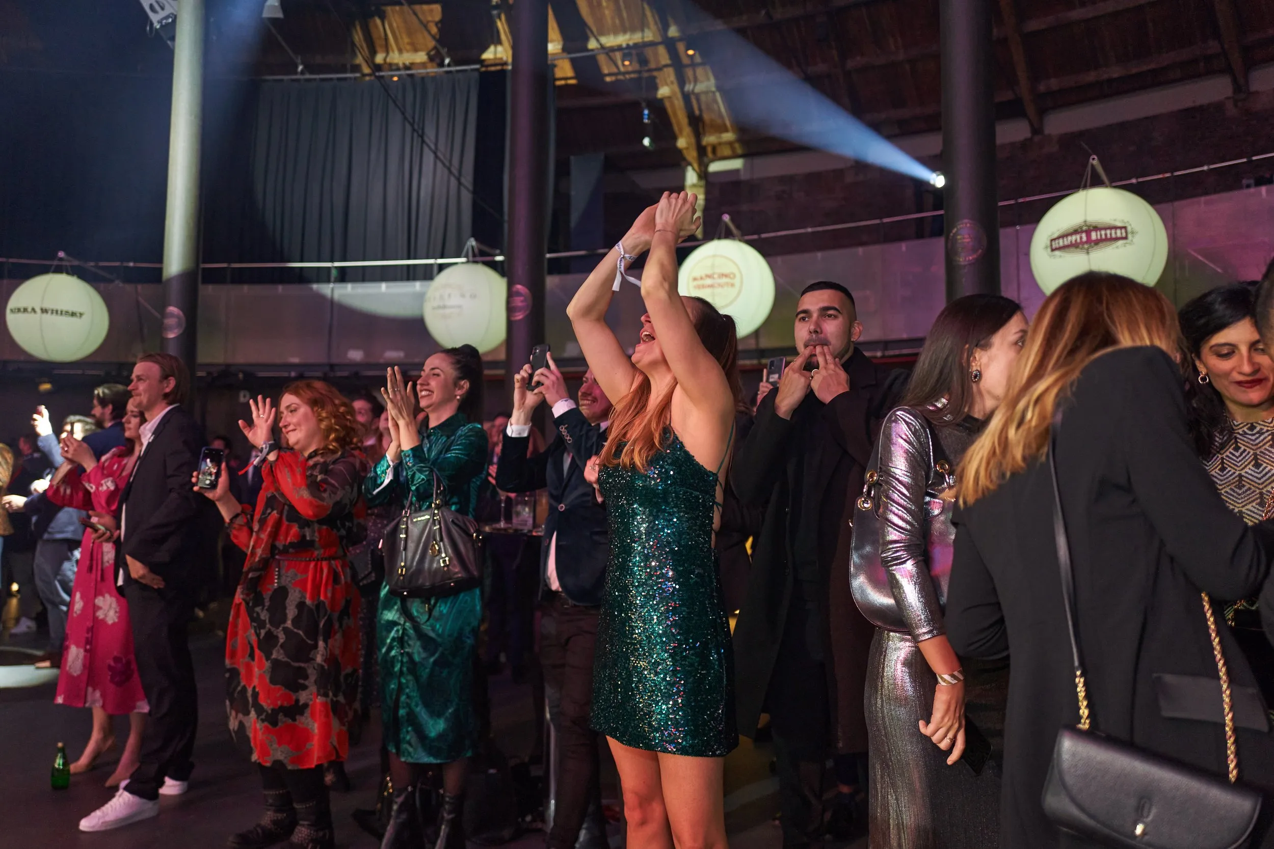 Large-scale awards ceremony with circular screen stage, corporate event photography London