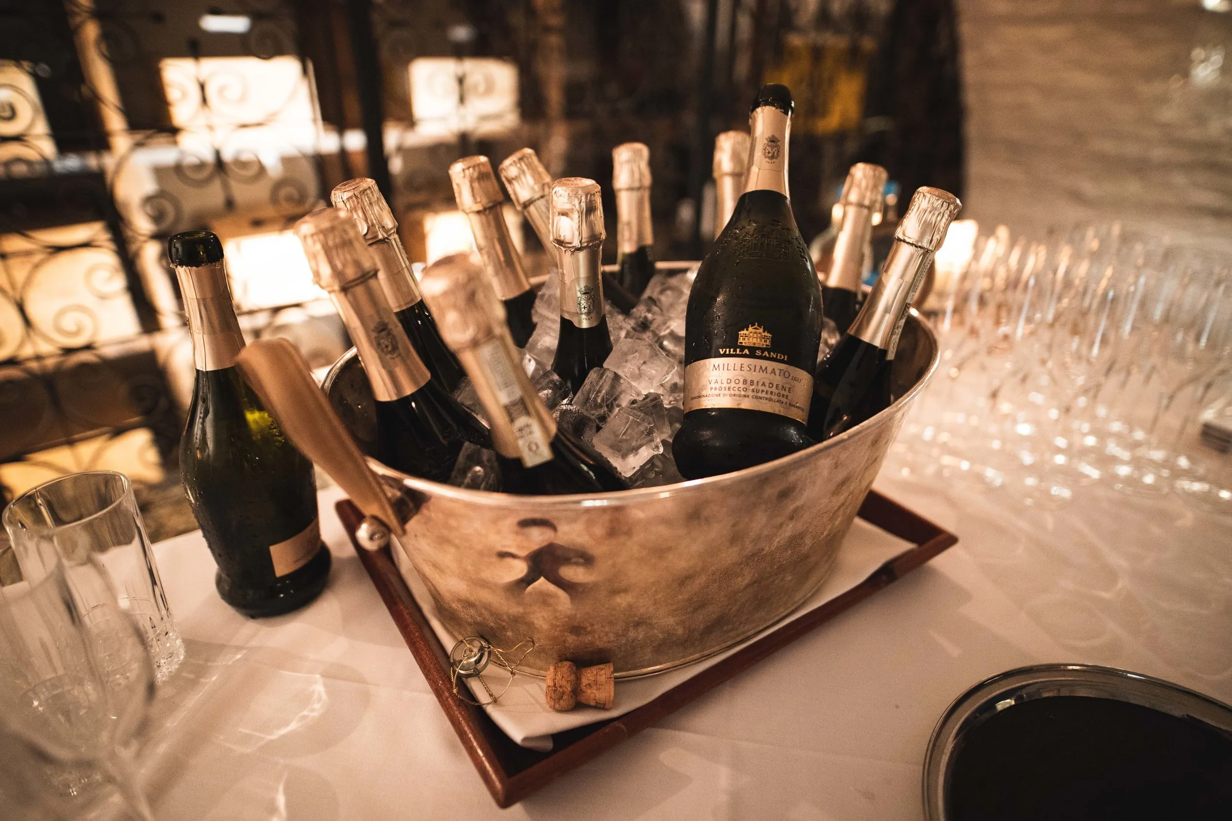 Prosecco bottles in ice buckets at a luxury corporate event venue, London