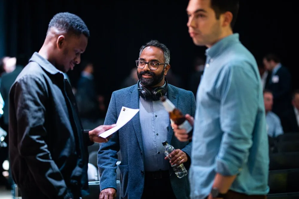 Three conference delegates networking over drinks, London conference photography