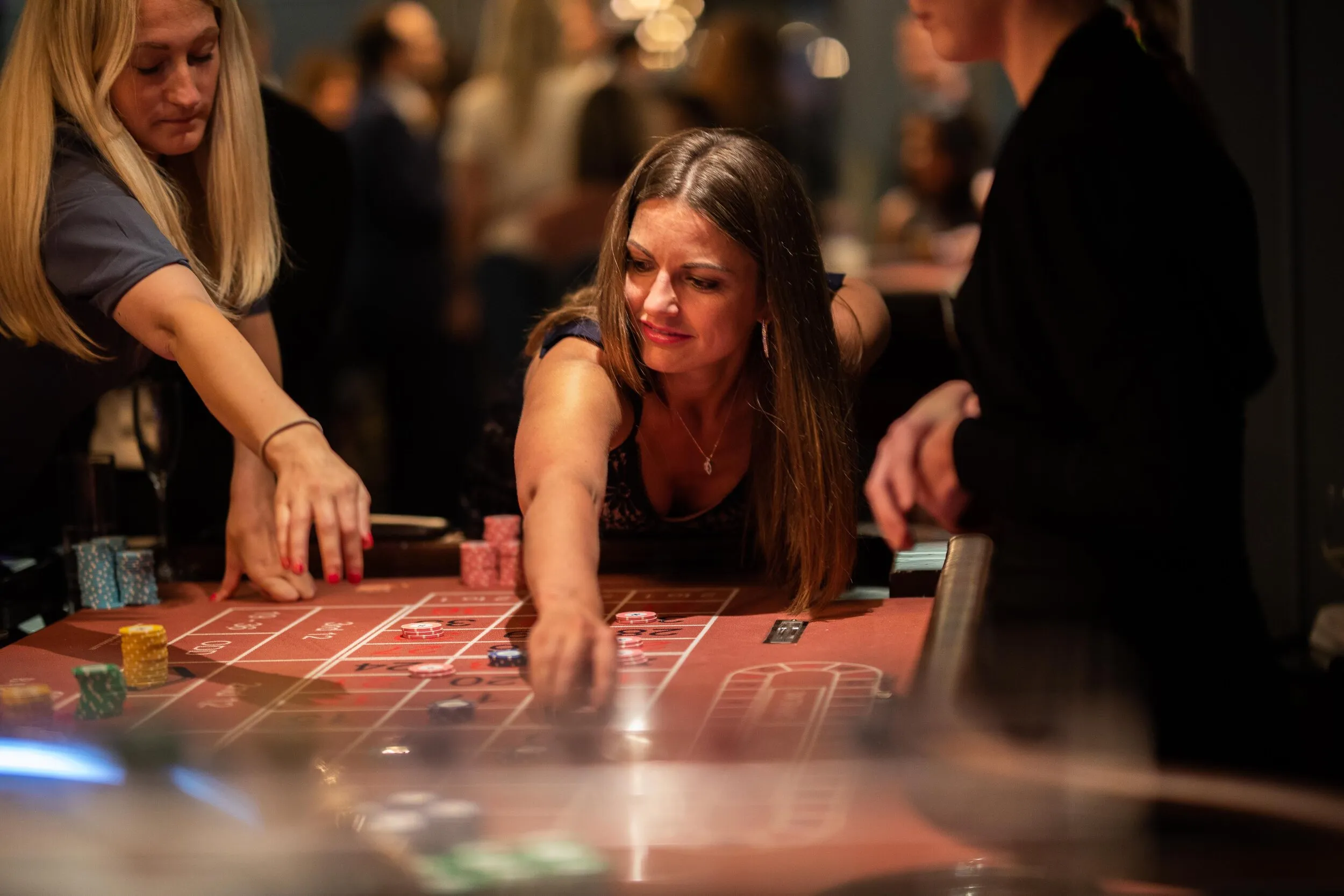 Woman playing roulette at a corporate charity casino night, London event photography