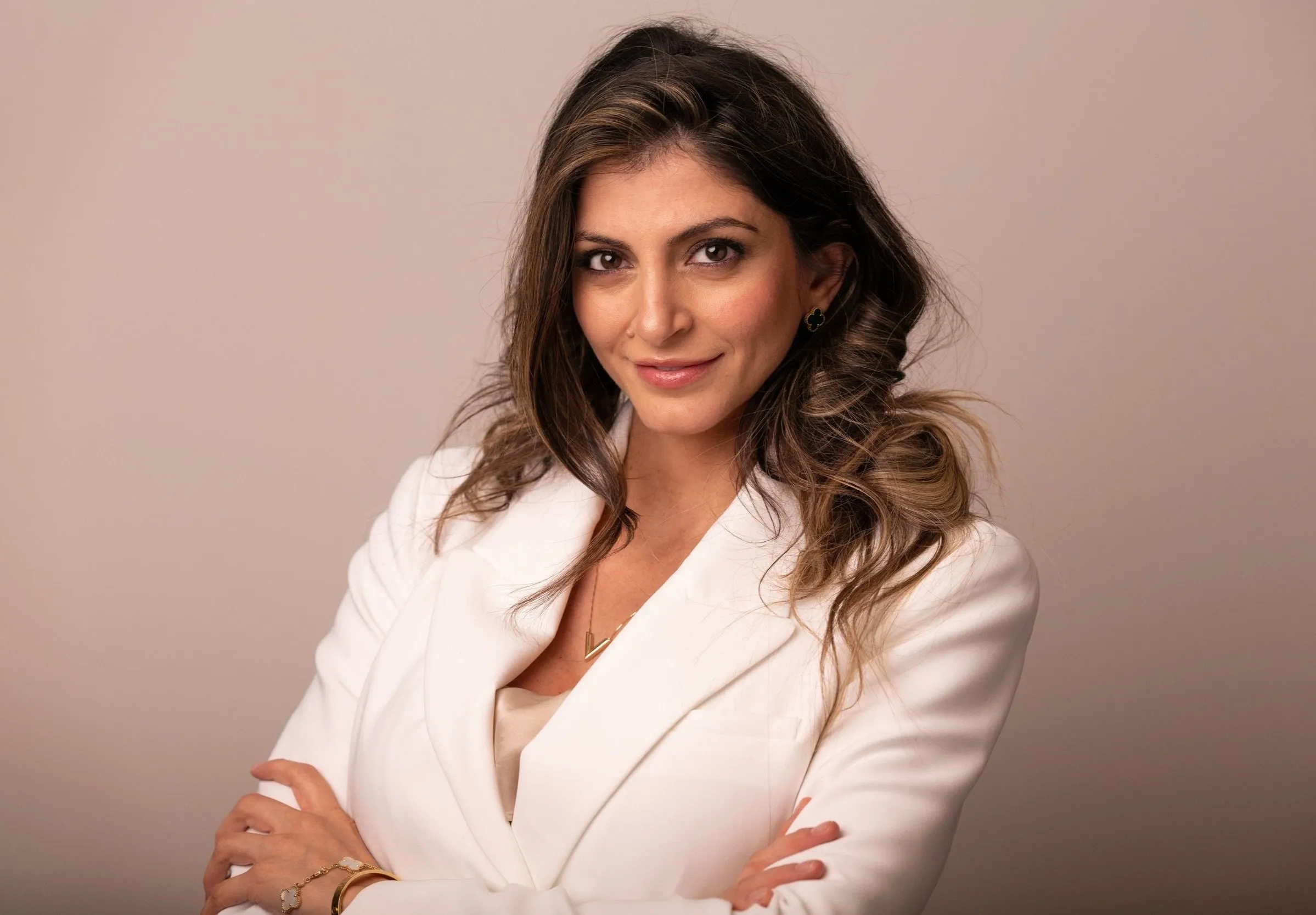 Professional corporate headshot of businesswoman in white blazer, London